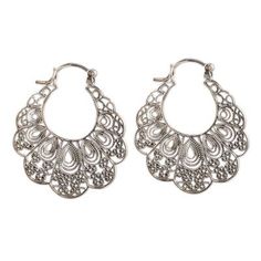 These lacy filigree hoop earrings are the design of Neetu Barathi in India. The earrings are crafted of sterling silver and feature delicate wirework within their scalloped forms. Metal Hoop Earrings With Intricate Dangle Design, Silver Nickel-free Hoop Earrings For Summer, Ornate Hoop Earrings With Intricate Design For Festival, Ornate Silver Hoop Earrings With Intricate Design, Ornate Intricate Hoop Earrings For Festival, Ornate Intricate Design Hoop Earrings For Festivals, Adjustable Filigree Earrings, Delicate Silver Jewelry For Summer, Delicate Silver Summer Jewelry