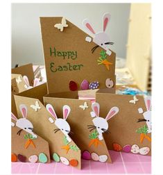 several bags with bunny ears and carrots on them, one is made out of brown paper