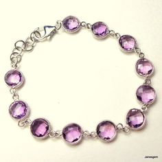 "This gorgeous bracelet is solid Sterling Silver, set with 30cts of Beautiful deep purple, natural, faceted, Amethyst gemstones. The translucence of the large, round, Clean, Fancy Cut, Deep, Rich color of the Sparkling, flawless, stones is breathtaking. The length of this Beauty is 7 1/2\", including the lobster claw clasp. The width is 9mm. I purchased this lovely bracelet many years ago, and it is in perfect condition, as it was only worn a few times. It has a very strong clasp, so you needn't Classic Bracelets, Bracelet Vintage, Gorgeous Bracelet, Sterling Silver Bracelet, Amethyst Gemstone, Antique Items, Gold Plated Sterling Silver, Purple Amethyst, Deep Purple