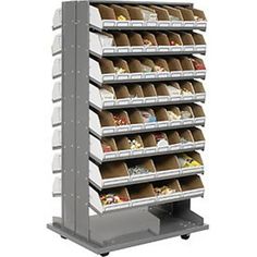 a metal shelving unit with bins and trays