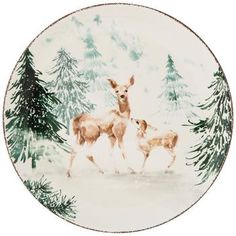 an image of two deer in the snow with pine trees on it's side