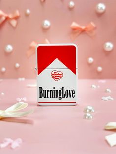 a red and white box with the word burning love on it