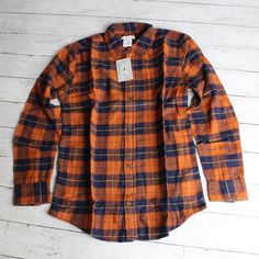 New With Tags Tommy Bahama Button Down Plaid Flannel Shirt 100% Cotton Fall Winter Youth Boy's Size Xxl Xx-Large 16 This Long Sleeve Button Up Flannel Shirt Is Navy Blue, Brown-Ish Orange And Golden Yellow Plaid. It Has A Full Button Up Front. It's A Really Sharp Looking Shirt And Is Brand New With Tags. Classic Orange Tops For Fall, Classic Orange Top For Fall, Collared Orange Shirt With Buttons, Orange Collared Shirt With Buttons, Orange Long Sleeve Shirt For Fall, Orange Cotton Shirt With Button Closure, Orange Relaxed Fit Cotton Shirt, Classic Orange Shirt For Fall, Orange Cotton Shirt For Fall