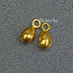 DESCRIPTION: Thank you for coming in! Exciting 18k solid gold finding! Handmade cute full teardrop charm that you can hang on your jewelry! You'll get 2 pieces per winning! Size: 3.3mmx8.2mm including 3mm loops(1.5mm holes) WEIGHT: 0.28 grams (approx) MATERIAL: 18k Solid Yellow Gold Gold Hypoallergenic Pear-shaped Teardrop Earrings, Gold Pear-shaped Hypoallergenic Teardrop Earrings, Gold Pear-shaped Teardrop Earrings As Gift, Gold Pear-shaped Teardrop Earrings For Gift, Tiny Teardrop Gold Jewelry, Gold Pear-shaped Drop For Gift, Nickel-free Yellow Gold Teardrop Earrings, Hypoallergenic Gold Dangle Charms, Gold Rate