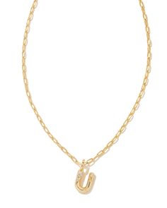 Personalize your everyday look with the Crystal Letter U Gold Short Pendant Necklace in White Crystal. Whether you’re rocking your initial or a loved one’s, this sentimental layer is one you’ll keep coming back to again and again. Metal 14k Gold Over Brass Material White CZ Closure Lobster clasp Size 16" chain w/ 3" extender, 0.62"L X 0.35"W pendantDue to the one-of-a-kind nature of the medium, exact colors and patterns may vary slightly from the image shown. | Kendra Scott Crystal Letter U Gold Gold Heart Stud Earrings, Short Pendant Necklace, Gold Heart Studs, Preppy Jewelry, Pearl Strands Necklace, Gold Shorts, Letter U, Buy Crystals, Studded Belt