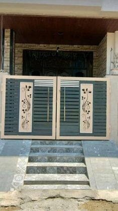 the front entrance to an apartment building with two doors and steps leading up to it