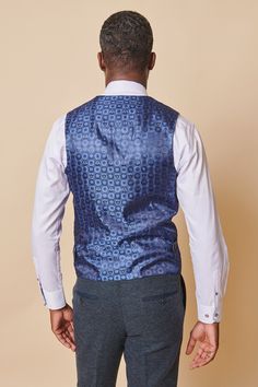 Look stylish in this men's blue tweed waistcoat. This timeless piece is crafted from premium poly wool mix tweed and features a single-breasted design for a flattering fit. Pair with your favourite trousers for a classic and handsome look. Model wears size 38R. Features Slim fit Single-breasted Five button fastening Adjuster straps Complimentary pocket square Style Tip | ﻿Pair with a crisp white shirt, black tie and matching trousers for a stylish occasional look. Composition Main: 80% Polyester Formal Tailored Tweed Vest, Tailored Tweed Vest For Formal Occasions, Business Tailored Tweed Vest, Fitted Blue Tweed Suits, Elegant Tweed Business Vest, Elegant Tweed Vest For Business, Fitted Blue Tweed Jacket With Welt Pockets, Elegant Fitted Tweed Vest, Fitted Blue Tweed Jacket For Business Casual