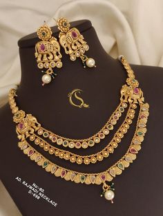 Description :- Indian Polki Necklace set Jewelry Jewellery / Bollywood Style Gold Finish South Indian wedding bridal Jewelry/gift for her Gift yourself a royal look with this perfectly crafted kundan necklace set from Manalisstudio. Crafted with high quality kundan stones and pearls, it is impressive in design. The green enamel artwork adds perfect texture to the design. Perfect for weddings and festivities, this antique necklace set should be put on with your favorite sari or lehenga. 100% Sati Polki Necklace Set, Polki Necklace, Bollywood Style, Kundan Necklace, South Indian Jewellery, Set Jewelry, South Indian Wedding, Kundan Necklaces, Antique Necklace