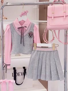 This girls' pink and grey school uniform set is designed for a stylish and sophisticated look, perfect for school and formal events. Made from high-quality materials, this outfit ensures comfort and durability, allowing your child to move freely throughout the day. Featuring a chic ribbon tie and button accents, this uniform set adds a touch of elegance and charm to your child's wardrobe. Available in both blue and pink, this uniform set offers versatile color choices to suit your child's personal style. Available in sizes 4T to 15Y, this school uniform set provides a perfect fit for girls of various ages, ensuring they look their best. High School Uniform, School Uniform Fashion, School Uniform Outfits, Kids Couture, Uniform Fashion, Pinterest Girls, Ribbon Tie, Blue And Pink, Formal Wear