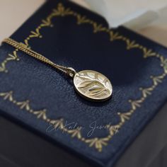 Oval-shaped, nature-inspired twig leaf medallion pendant handcrafted in 10K solid gold. The pendant comes with a 14K solid gold cable chain. Ships within 3 business days. - Pendant size: 9.5x7mm - Chain width: 1.1mm - Chain length: 16.5" - Made in 10 and 14 karat gold. - Stamp with 10K and 14K. Layering Necklaces, Leaf Pendant, Cable Chain, Chain Lengths, Layered Necklaces, Chain Length, Nature Inspired, Solid Gold, Nature Inspiration