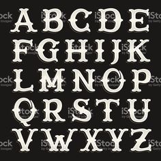 the english alphabet with white paint on black background royalty