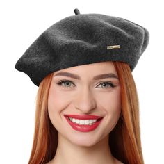 a woman with red hair wearing a gray hat