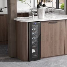 a wine cooler in the middle of a kitchen counter