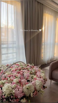 a living room filled with furniture and flowers