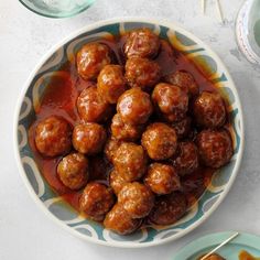 meatballs with sauce in a bowl on a table