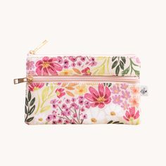 This versatile pencil pouch is designed to keep your art supplies or make-up essentials organized and accessible. Designed to be compact and portable, this pouch effortlessly fits into your bag, ensuring creativity is always within reach. Features: - Nylon lining - Polyester Canvas- Size: 7.5" x 4.75" - Gold colored metal zipper pull - Main zipper & front zipper pocket - ImportedFor best care, handwash in cold water and lay flat to dry. This product is a Elyse Breanne Design Travel Cosmetic Bag With Zipper Closure, Pencil Shape, Travel Cosmetic Pencil Bag With Zipper Closure, Rectangular Pencil Case With Removable Pouch For Everyday Use, Everyday Pencil Cosmetic Bag With Zipper, Multicolor Pencil-shaped Pencil Case For Travel, Multicolor Zipper Pouch Pencil Case For Travel, Pink Pencil Case With Pen Holders, Rectangular Zipper Pouch Pencil Case For Organization, Pencil Cosmetic Bag With Pen Holders For Everyday Use