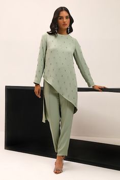 Mint asymmetric top with crystal hand embroidery. Paired with a pant. - Aza Fashions Elegant Fitted Asymmetrical Set, Fitted Asymmetrical Sets For Festive Occasions, Fitted Sets With Asymmetrical Hem For Party, Fitted Sets With Asymmetrical Hem For Festive Occasions, Festive Fitted Sets With Asymmetrical Hem, Elegant Sets With Asymmetrical Hem For Party, Festive Sets With Fitted Asymmetrical Hem, Elegant Asymmetrical Fitted Set, Elegant Party Sets With Asymmetrical Hem