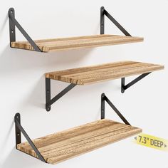 two wooden shelves with metal brackets on each shelf