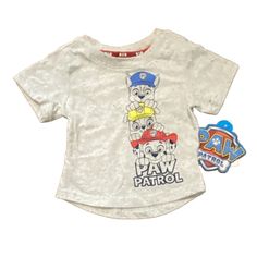 Get Ready For Some Adventure With This 18m Paw Patrol Shirt! Featuring Marshall And Chase From The Beloved Paw Patrol Series In A Solid Gray Color, This T-Shirt Is Perfect For Your Little One's Casual Everyday Wear. The Short Sleeves And Round Neckline With Pullover Closure Make It Easy To Dress Up Or Down. Made From A Comfortable Blend Of Polyester And Cotton, This Shirt Is Perfect For Walking, School, Or Any Other Everyday Activity. It Is Brand New With Tags And Comes In A Regular Fit Suitable Cotton Tops With Character Print For Playwear, Casual Tops With Character Print For Playtime, Playtime Graphic Tee With Character Print, Graphic Tee With Character Print For Playtime, Graphic Tee Tops With Character Print For Playtime, Short Sleeve Shirt For Playtime, Graphic Tee Shirt For Playtime With Short Sleeves, Short Sleeve Graphic Tee For Playtime, Pre-shrunk Cotton Tops For Playtime