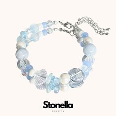 The "Ocean Tranquility" bracelet is designed to bring a sense of calm and peace to the wearer. Inspired by the serene beauty of the ocean, this bracelet symbolizes tranquility, clarity, and emotional balance. The soothing blue tones and ocean-themed elements evoke the peacefulness of the sea, encouraging the wearer to embrace inner calm and clarity. Elements: Blue Beads: Central to the bracelet, these beads symbolize calmness, clarity, and emotional balance. The various shades of blue evoke the Sea Theme Bracelets, Sea Themed Bracelet, Ocean Themed Bracelets, Ocean Braclets, Water Bracelet, Ocean Bracelet, Protective Charms, Trendy Bracelet, Trendy Bracelets