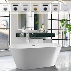 a large white bath tub sitting in front of a window next to a potted plant