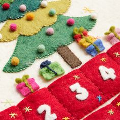 felt christmas stockings with numbers and decorations on them