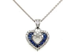 PRODUCT DESCRIPTION: 18k White Gold Dainty Heart Charm Pendant Necklace With Genuine Blue Sapphire Stones & Diamond Bale / Diamond And Sapphire Heart Charm - Solid 18k Gold: 2.78 Grams - 37 Natural Diamonds / Total Weight: .60 Carats - High Quality Diamonds: (F-G Color / VS Clarity) - Genuine Blue Sapphires: - 17 Stones / .73 Carats  - Pendant Dimensions: (15mm Height) x (16mm Width) - Chain Details: Solid 18k Gold Cable Chain With Lobster Lock (Approx 1mm Chain Width)  ------------------------- Formal Sapphire Heart Necklace, Blue Heart Cut Necklace For Formal Occasions, Sapphire Heart Pendant Jewelry For Valentine's Day, Heart-shaped Sapphire Jewelry For Formal Occasions, Heart-shaped Sapphire Necklace For Anniversary, Sapphire Heart Necklaces For Anniversary, Sapphire Heart Necklace For Anniversary, Blue Necklace With Round Heart Charm, Heart-shaped Blue Jewelry For Anniversary