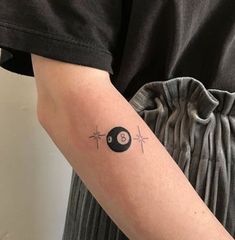 a person with a small tattoo on their arm