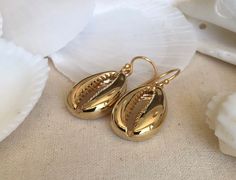 This listing is for one pair of shell earrings only. The other earrings shown are for display purposes only but are available on my website and are sold separately. They are beautiful shiny medium sized shell earrings with gold mirror finishes on a 24k gold vermeil (on silver). The shell measures width 14mm or 22mm and the  Overall drop- length is 31.83mm or1.25 inches. Gold Shell-shaped Brass Earrings, Gold Brass Shell-shaped Earrings, Gold-plated Shell-shaped Earrings, Gold Shell-shaped Jewelry With Matching Earrings, Gold Plated Shell-shaped Earrings, Gold Shell With Matching Earrings, Yellow Gold Shell-shaped Earrings, Yellow Gold Shell-shaped Earrings For Pierced Ears, Gold Brass Shell Earrings