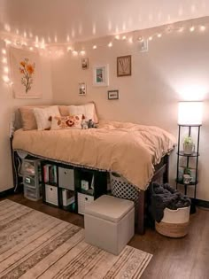 a bedroom with a bed, rug and lights on the wall