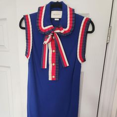 Gucci Sleeveless Blue Dress With Red White And Blue Ribbon And Gold Logo Buttons Size M, 100% Viscose Excellent Condition Chic Gucci Sleeveless Dress, Gucci Yellow Dress, Gucci Red Dress, Blue Cotton Gucci Tops, Sleeveless Blue Dress, Fitted Sleeveless Gucci Mini Dress, Gucci Dresses, Blue Sleeveless Dress, Gold Logo