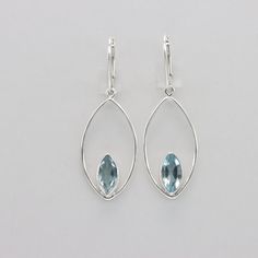 This is a beautiful pair of Blue Topaz Earrings in 925 Sterling Silver. They are made out of Sterling Silver with no nickel so there should be no allergic reaction and nothing will turn green. The silver is not only silver plated or steel but solid 925 Sterling Silver. Please note: Our jewelry is photographed close up to show detail and may appear larger than they are. We use a dime coin as size reference on one of the pictures. We usually ship the same day in a nice gift box. Sterling Silver Marquise Earrings For Pierced Ears, Sterling Silver Marquise Earrings, Oval Sterling Silver Teardrop Earrings, Blue Topaz Earrings, Topaz Earrings, Solid 925 Sterling Silver, Beautiful Earrings, Blue Topaz, Jewelry Earrings Dangle