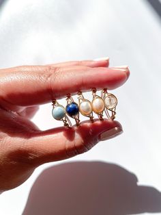 Please read before ordering: Listing is for our limited edition pastel summer ring set Ring set includes the following crystals / beads: - Aquamarine - Sodalite - White Pearl - Blush Pearl - Citrine Available in sizes 3-13.5 - depending on your personal preference, for a looser fit I would recommend sizing up 1/2 - 1 from your regular size. Made out of tarnish-resistant plated wire in your choice of either silver or gold. If you would like different colored wire for certain rings, feel free to l Rings Summer, Summer Rings, Crystals Beads, Wire Wrapping Crystals, Set Ring, Rings Set, Crystal Ring, Crystal Rings, Healing Crystal