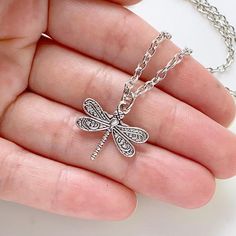 Dragonfly Necklace Silver Dragonfly Jewelry Dragonfly Lover Gift for Women-I make this necklace using an antique silver dragonfly charm and chain-Pick any chain length from the dropdown menu, if you don't see the length you want, select "custom" and leave it in the 'note to seller' at checkout-Pendant measures 1" tall x 7/8" wide-Nickel free lead free alloy metal-GIFT BOXEDMore of my Dragonfly Jewelry Here:https://www.etsy.com/shop/lydiasvintage/items?search_query=dragonflyMore of my Necklaces:h Vintage Silver Necklace With Butterfly Charm, Bohemian Silver Dragonfly Necklace, Dragonfly Jewelry, Dragonfly Charm, Dragonfly Necklace, Dragonfly Pendant, Mismatched Earrings, Necklace Silver, Gift For Women