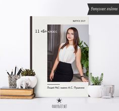 a photo frame with an image of a woman in white shirt and black skirt on top of a desk