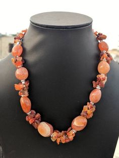 Add charm and glamour to your outfit with this strikingly beautiful handcrafted natural stone necklace in vibrant hues.Pair it up with any semi formal or casual attire and win compliments all the way.Necklace weight112 GM'sLength10 " Agate Beaded Necklaces For Jewelry Making, Agate Necklaces With Natural Stones, Elegant Orange Agate Necklace, Orange Agate Gemstone Necklace, Unique Orange Agate Necklace, Elegant Amber Beaded Necklace With Stones, Elegant Orange Necklaces With Natural Stones, Artisan Orange Gemstone Necklace, Unique Orange Gemstone Bead Necklaces