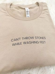 Can't Throw Stones While Washing Feet - Unisex T-shirt Can’t Throw Stones While Washing Feet Quote, Stretch Crew Neck T-shirt With Text Print, Stretch Short Sleeve T-shirt With Text Print, Short Sleeve Stretch T-shirt With Text Print, Cotton Stretch T-shirt With Text Print, Funny Text Stretch Short Sleeve T-shirt, Stretch Graphic Tee With Crew Neck, Stretch Cotton T-shirt With Funny Text, Stretch Graphic Tee With Letter Print