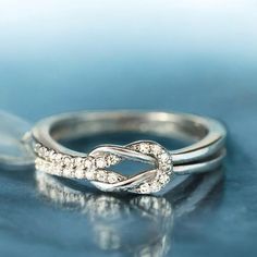 an image of two wedding rings with diamonds on them