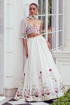 Ivory can can attached lehenga featuring resham embroidered floral motifs embellished by sequins. Comes with butterfly applique padded draped blouse and dupatta. - Aza Fashions White Bollywood Sleeveless Lehenga, White Bollywood Lehenga, White Sleeveless Bollywood Lehenga, White Embellished Sleeveless Set, White Embellished Sleeveless Choli, White Floor-length Sharara With Floral Embroidery, White Floral Embroidery Floor-length Sharara, White Floor-length Choli With Floral Embroidery, White Floral Embroidered Floor-length Lehenga