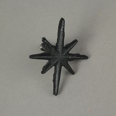 a black star shaped object sitting on top of a table