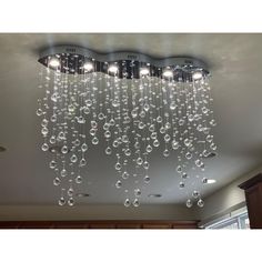 a chandelier hanging from the ceiling in a room