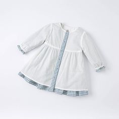 This blue and white gingham dress is full of feminine contemporary detailing. It features a peter pan collar with embroidered cherries and laces, buttons closure at the front and comes with a matching pink cross-shoulder bag. Wear as a set or mix and match with children's favorite looks; the style possibilities are endless. ] Material: Cotton Spring School Dress With Peter Pan Collar, Spring School Dresses With Buttons, Preppy Long Sleeve Spring Dresses, Spring Blue Plaid Cotton Dress, White Plaid Dress For Spring Picnic, White Plaid Dress For Picnic In Spring, Cotton School Dresses With Buttons, Long Sleeve Ruffled Dress For Picnic, Preppy White Ruffled Dress