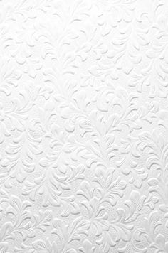 white textured paper with floral design on it