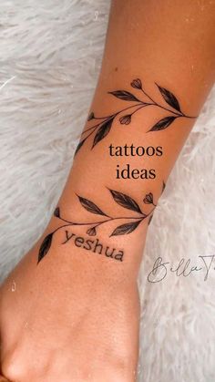 a woman's wrist tattoo with the word yeshua written on it and leaves