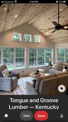 a living room with two couches and a ceiling fan in the middle of it