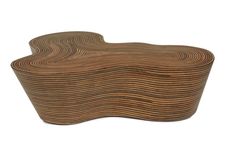 a wooden bench with wavy lines on it's sides and an oval shaped top