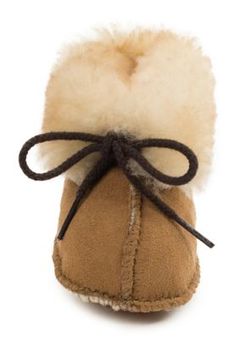 Let them float into the comfort of the Minnetonka Infants' Sheepskin Baby Booties. Ultra-soft suede and a fluffy sheepskin cuff snuggle little feet for unmatched warmth and comfort while they're wearing their sheepskin baby booties. A durable suede outsole protects those tiny toes while the baby booties' simple tie closure offers easy on and off for the tiniest trendsetters. Super comfortable baby booties with sheepskin lining and suede upper Cushioned insole keeps baby comfortable while they walk in their sheepskin baby booties Suede softsole is very comfortable for young children Runs half size large Kids Slippers, Tractor Supply, Kids Boots, Baby Booties, Soft Suede, Infants, Casual Boots, Kid Shoes, Trend Setter