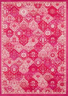 a pink and red rug with an intricate design