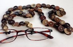 a pair of glasses sitting on top of a table next to a bunch of buttons