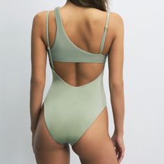 The Luna series, notable for its playful neckline details and comfortable fit, is an ideal option for those who prefer a simple and elegant style at the beach. This swimsuit, which can be comfortably worn both at the beach and by the pool, will provide comfort throughout the day. You can complete the look with denim pieces and carry your beach elegance to the city. Back neckline. Adjustable straps. Ribbed trim fabric. Gold-plated House of Silk gem at the center of the chest. 81% Polyamide 19% El Chic Seamless Swimwear For Poolside, Chic Solid Swimwear For Beach Season, Chic Solid Color Swimwear For Beach Season, Chic Seamless Bodysuit For The Beach, Fitted Seamless Swimwear For Summer, Chic Seamless Swimwear For Beach, Backless Seamless Swimwear For Beach Season, Summer Triangle Top One Piece For Poolside, Triangle Top One Piece For Summer Poolside